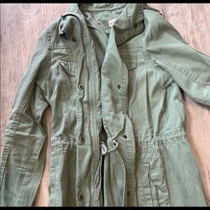 cute green jacket/ buttons and zips.